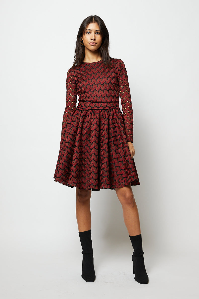 Black and red patterned mini dress with long sleeves