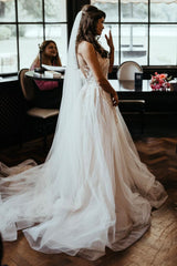 Fitted wedding dress covered in pearls and embroidery